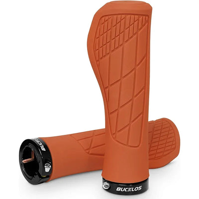 BUCKLOS ergonomic MTB handlebar grips in orange, featuring a soft rubber design and aluminum lock rings.