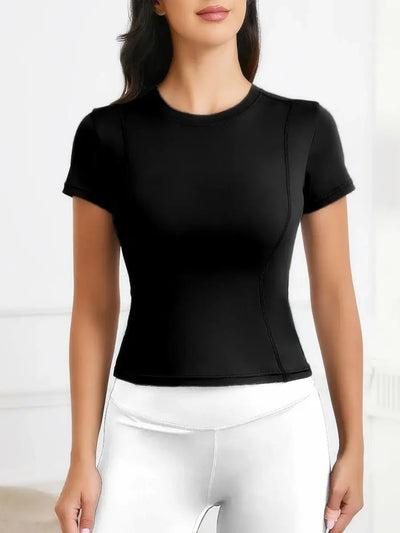 Women's short sleeve black workout top for yoga, featuring a fitted design in breathable material.