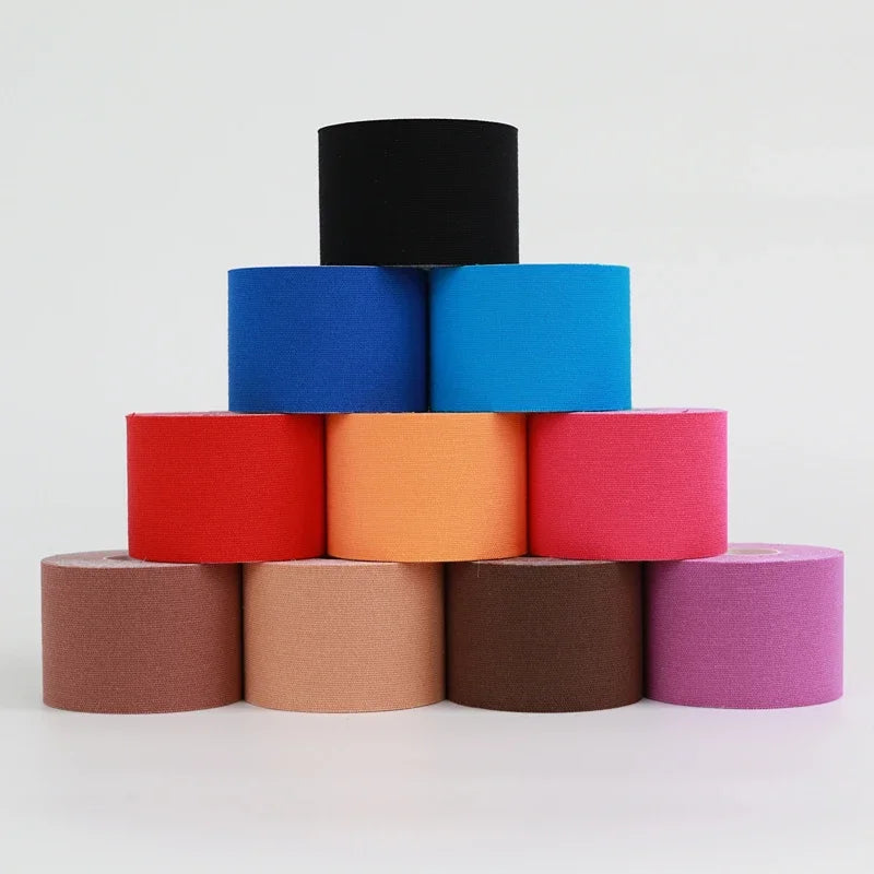 Colorful rolls of 5-10 cm sports kinesio tape for muscle pain relief and athletic recovery.