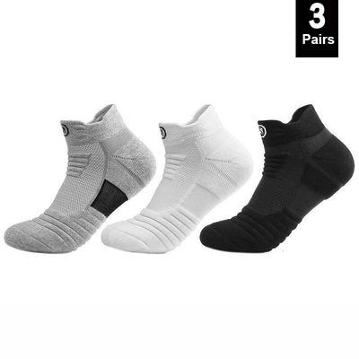 Three pairs of elastic compression sports socks in gray, white, and black, designed for comfort and breathability during workouts.