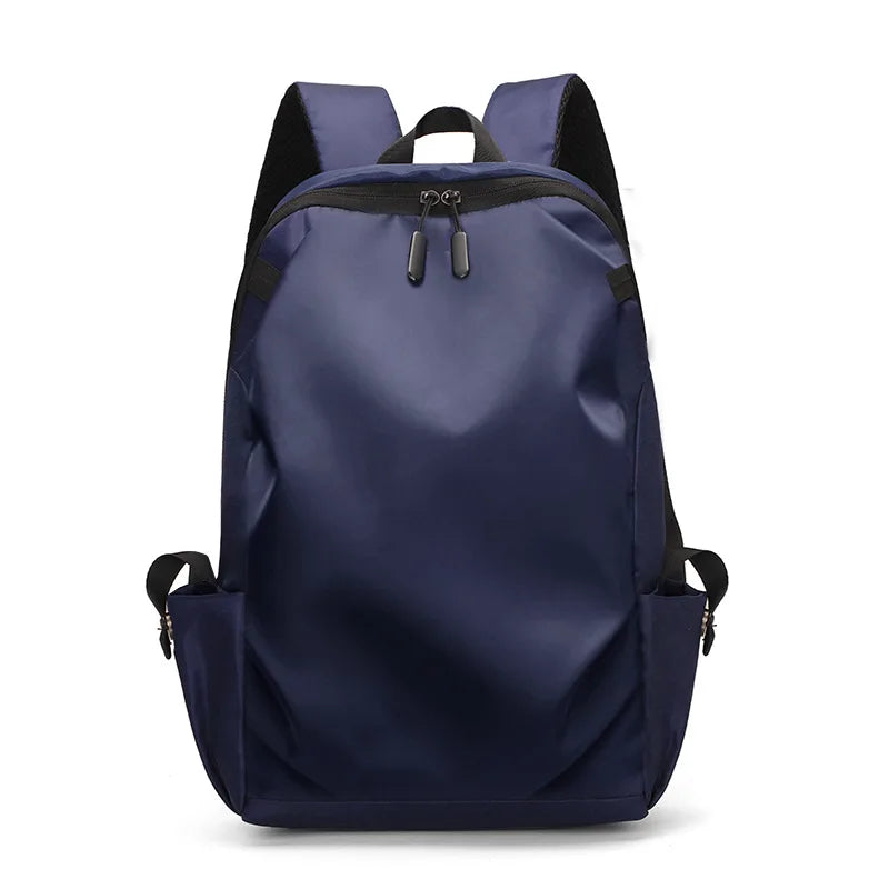 Navy blue unisex rucksack backpack with soft straps, suitable for students, laptops, and everyday use.