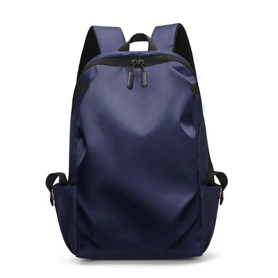 Navy blue unisex rucksack backpack with soft straps, suitable for students, laptops, and everyday use.