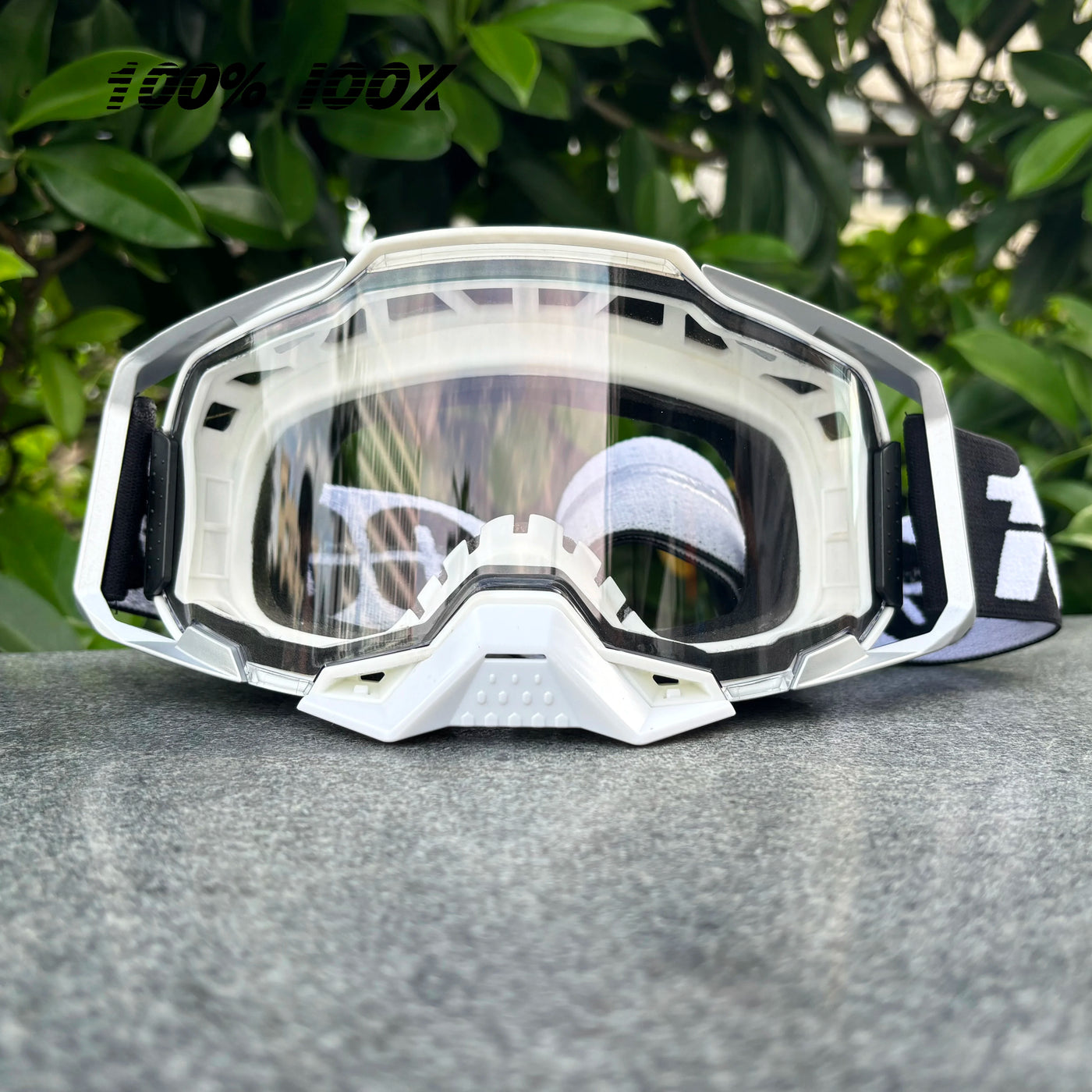 100% IOOX off-road MTB goggles with clear lens, designed for dirt bike racing and cycling, unisex protective eyewear.