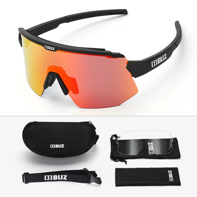 BLIZ Breeze polarized cycling glasses with orange lens, carrying case, and cleaning cloth for UV protection during MTB and road biking.