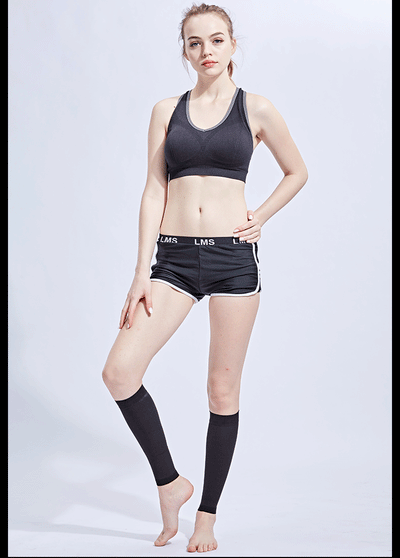 Model showcasing footless compression calf sleeves with sportswear, ideal for fitness and medical support.