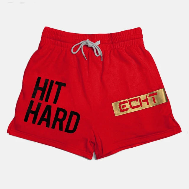 Men's red sports shorts featuring 'HIT HARD' graphic, lightweight and breathable for gym and running activities.