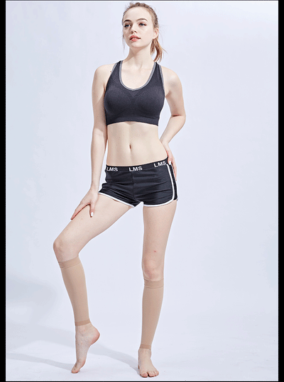 Model wearing compression footless calf socks with black athletic wear, showcasing comfort and style for active use.