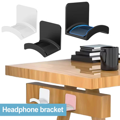 Universal headphone hanger set in white and black, mounted on a desk, showcasing convenient storage for headphones.