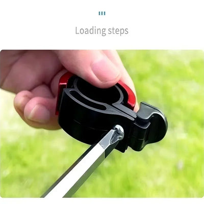 A close-up of a hand loading a bike bell mechanism, showcasing the assembly process in the outdoors.