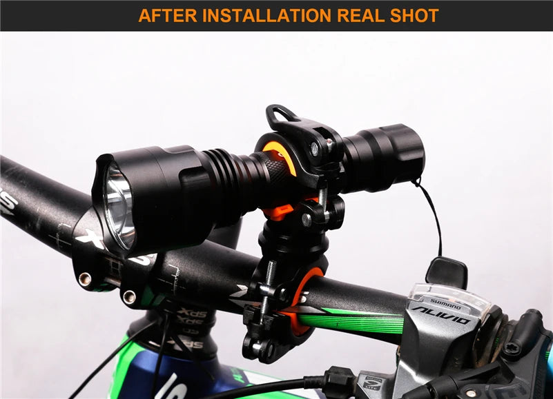 Installed 360° rotatable bike light bracket on handlebars, showcasing LED flashlight holder for cycling convenience.