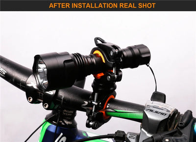 Installed 360° rotatable bike light bracket on handlebars, showcasing LED flashlight holder for cycling convenience.