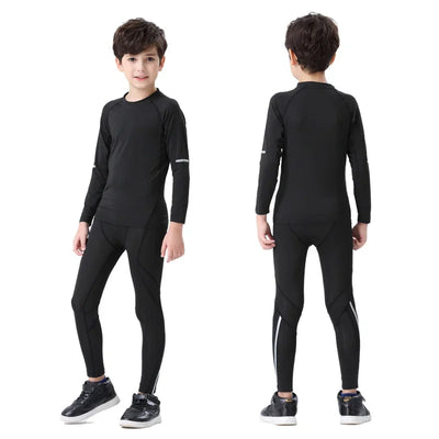 Boys wearing black thermal sports set, including compression tights and long-sleeve top for winter running.
