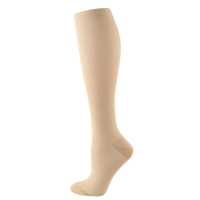 Knee-high solid color compression sock in beige for women, ideal for nurses and cycling, made of nylon.