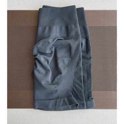 Gray women's contour shorts made from nylon and spandex, ideal for yoga and gym workouts.