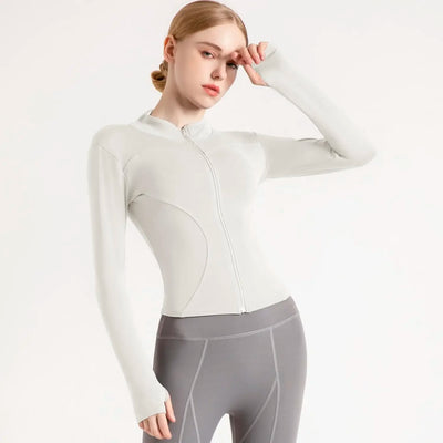Women's lightweight sports jacket with long sleeves, breathable fabric, and zipper, perfect for gym workouts and running.