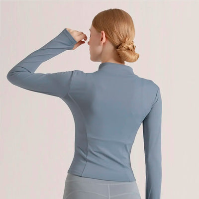 Back view of women's lightweight breathable sports jacket in blue, ideal for running and workout activities.