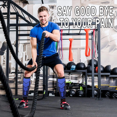 Man in compression socks exercising with battle ropes in gym, promoting calf support and pain relief.
