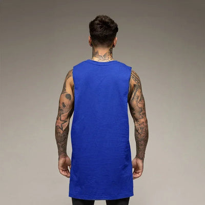 Back view of a man wearing a blue sleeveless fitness shirt, showcasing tattoos and stylish design for gym workouts.