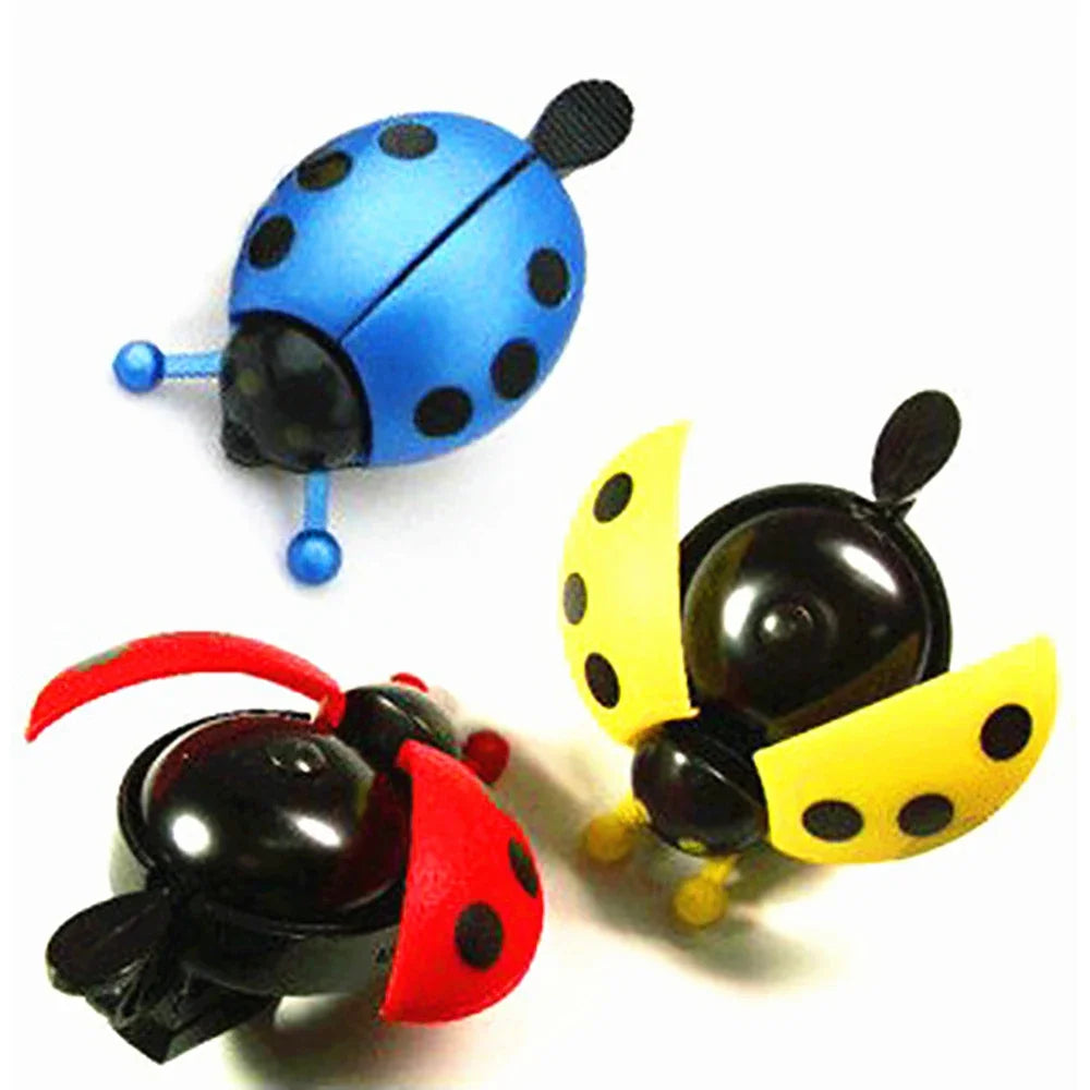 Colorful cartoon ladybug bike bells in blue, red, and yellow designs, perfect mini horn for kids' bicycles.