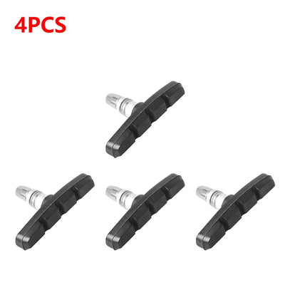Set of 4 durable rubber V-brake pads for mountain and folding bikes, designed for reliable braking performance.