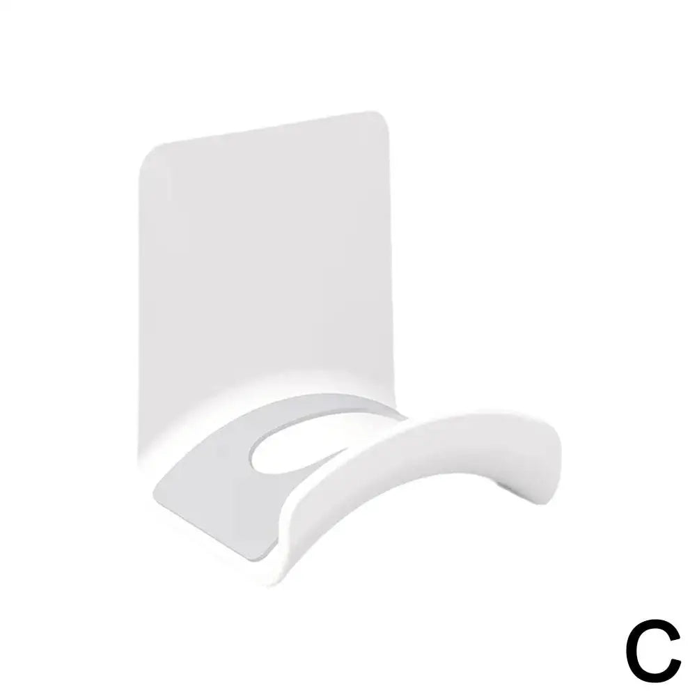 Universal headphone stand with adhesive wall mount for under desk headset storage.